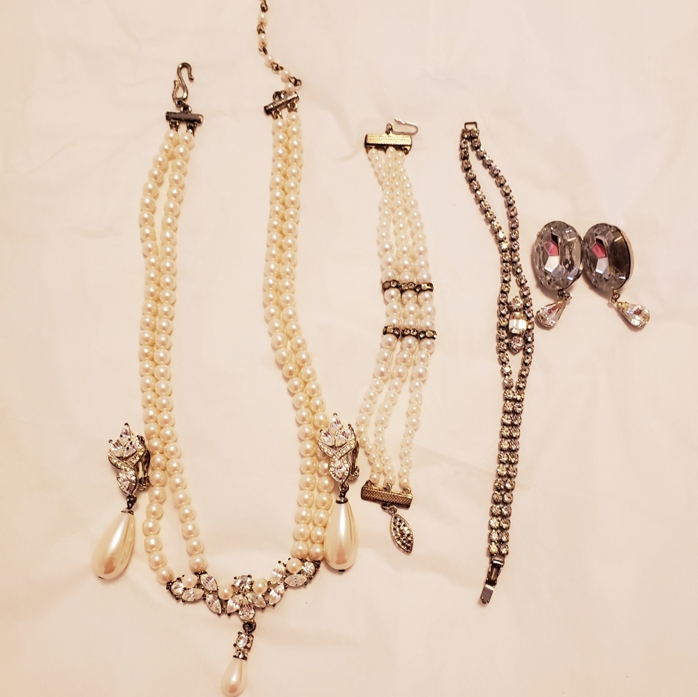 A lot of rhinestone and pearls jewelry